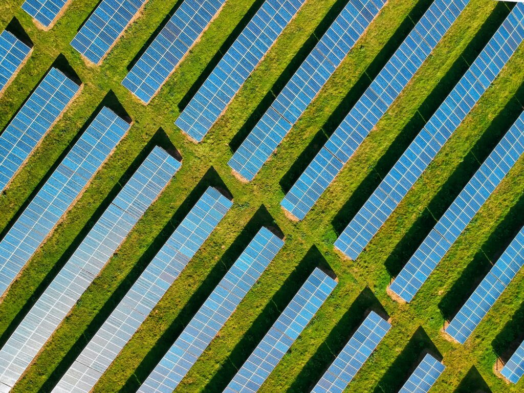 Field of solar panels in strips