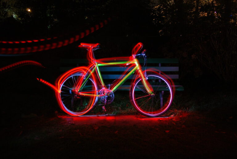 Photo of bicycle picked out by coloured light