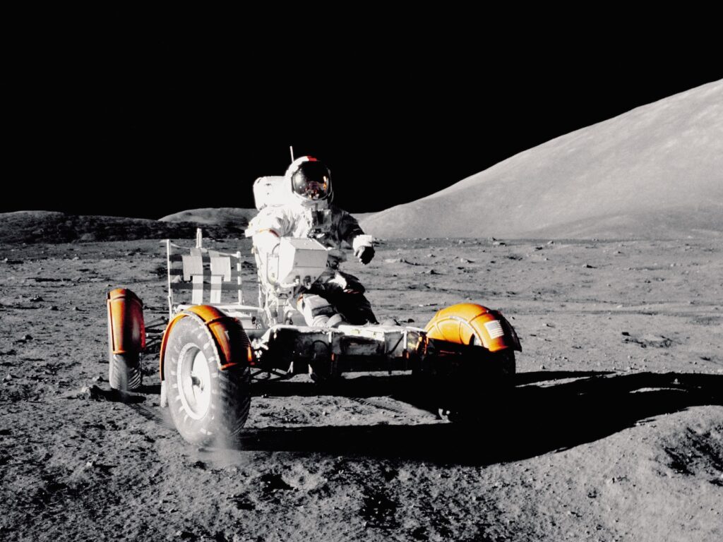 Astronaut Gene Cernan driving lunar rover on the Moon, 1972
