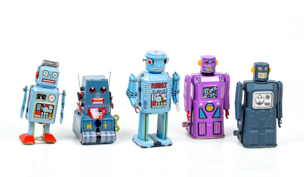 Five robot toys, blue and purple in colour