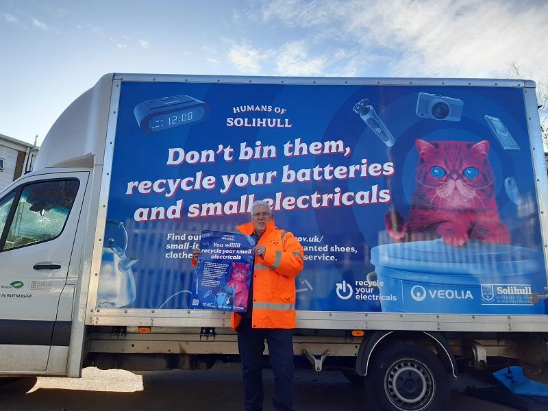 Cllr Hawkins with the 'Recycle your electricals' lorry panel and poster