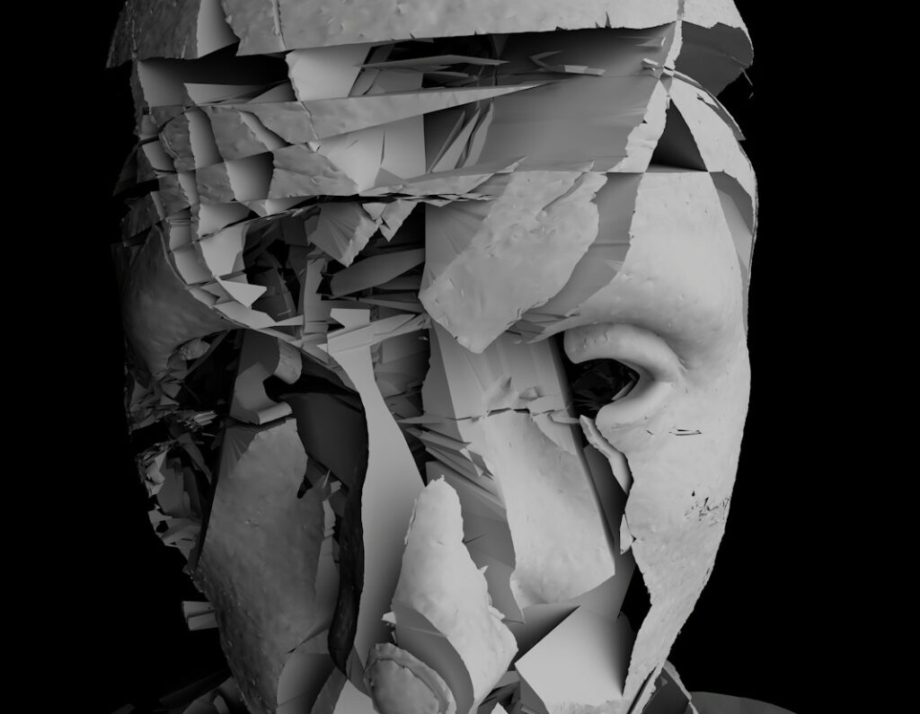 a black and white photo of a man's face covered in torn paper