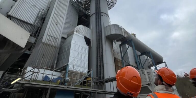 People in hard hats in front of the UK's first smart electricity substation, at Allington Energy from Waste in Maidstone, Kent. Photo courtesy of UK Power Networks