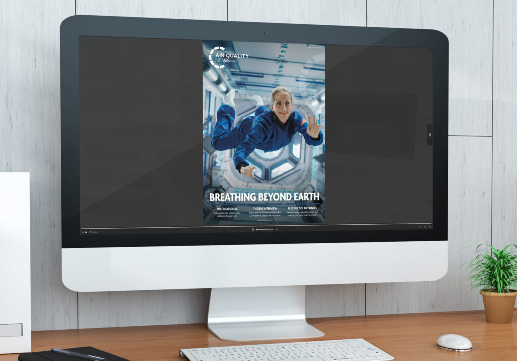 Screen showing the latest issue of Air Quality News Magazine, with an astronaut floating inside a spacecraft