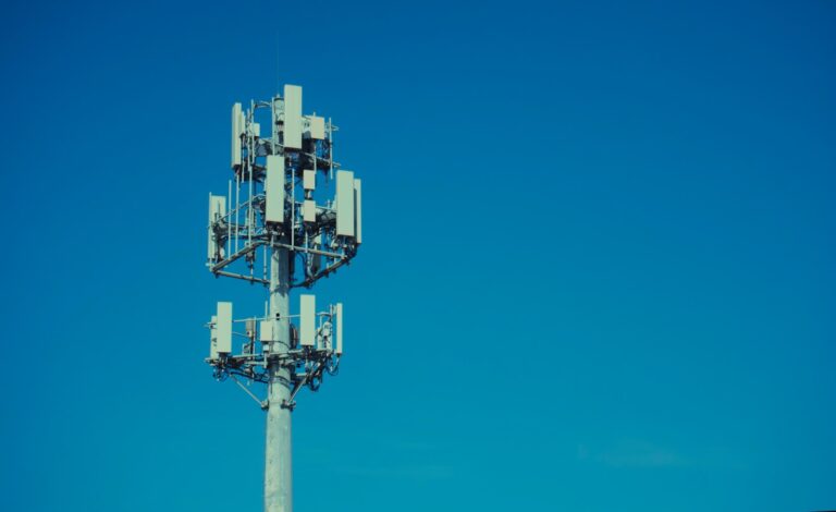 Cell tower against a clear blue sky